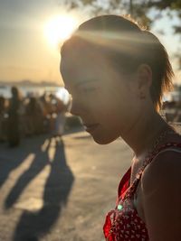 Portrait of woman on beach during sunset