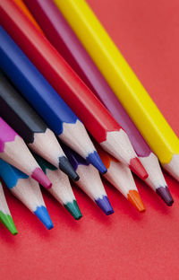 Colored pencils on bright colored background