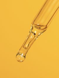 Close-up of water against yellow background