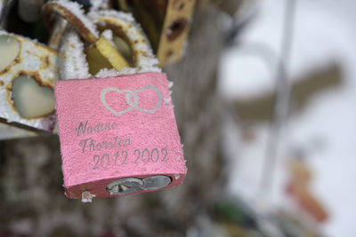 Close-up of love text hanging