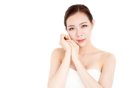 Portrait of woman against white background