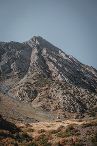 Scenic view of rocky mountains against clear sky