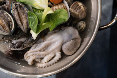 View of the raw octopus in the stew before boiling