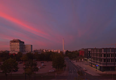 City buildings against sky at sunset