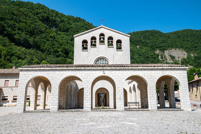 Exterior of historic building against clear blue sky