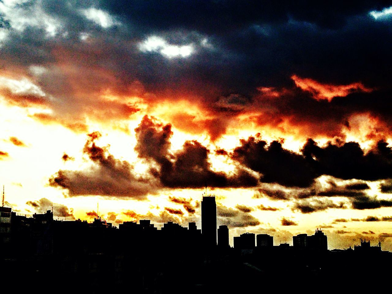 sunset, silhouette, building exterior, architecture, sky, built structure, cloud - sky, orange color, dramatic sky, city, cloudy, cloud, beauty in nature, scenics, low angle view, weather, cityscape, moody sky, nature, building