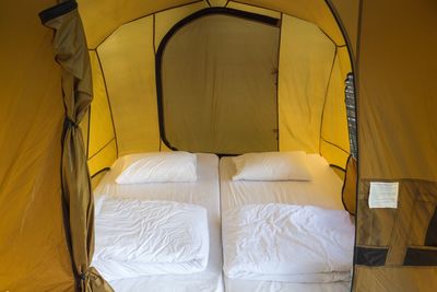 Close-up of bed in tent