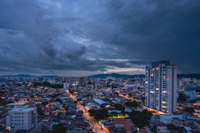 High angle view of illuminated cityscape against sky