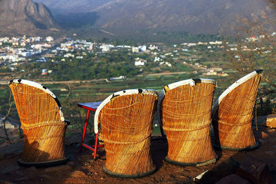 Wicker chairs on hill overlooking landscape