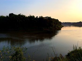 Scenic view of lake at sunset