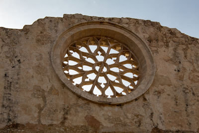 Low angle view of old building against sky