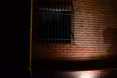 Close-up of window on brick wall