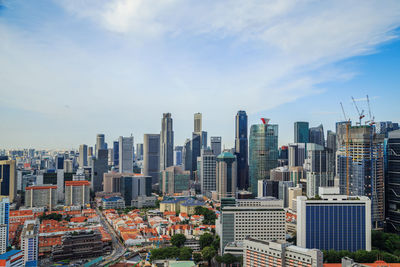 Modern buildings in city against sky