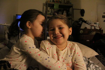 Close-up of happy siblings at home