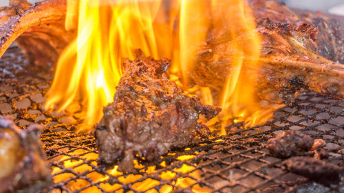 Close-up of meat on barbecue grill