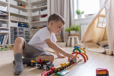 Side view of boy playing in gym