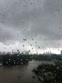 Full frame shot of wet glass window during rainy season