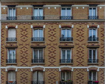 Windows in symmetry. open windows of a building with light background.