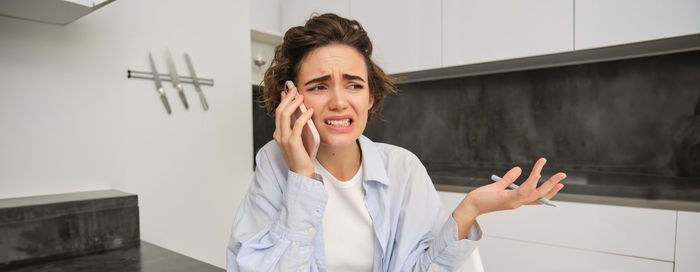 Young woman using mobile phone