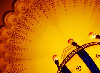 Low angle view of illuminated chandelier