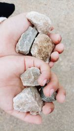 Close-up of hand holding rock