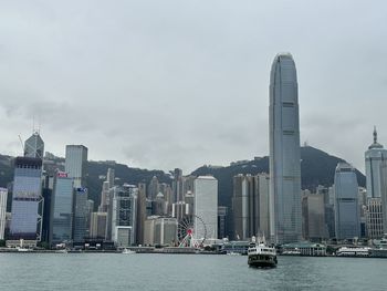Modern buildings in city against sky