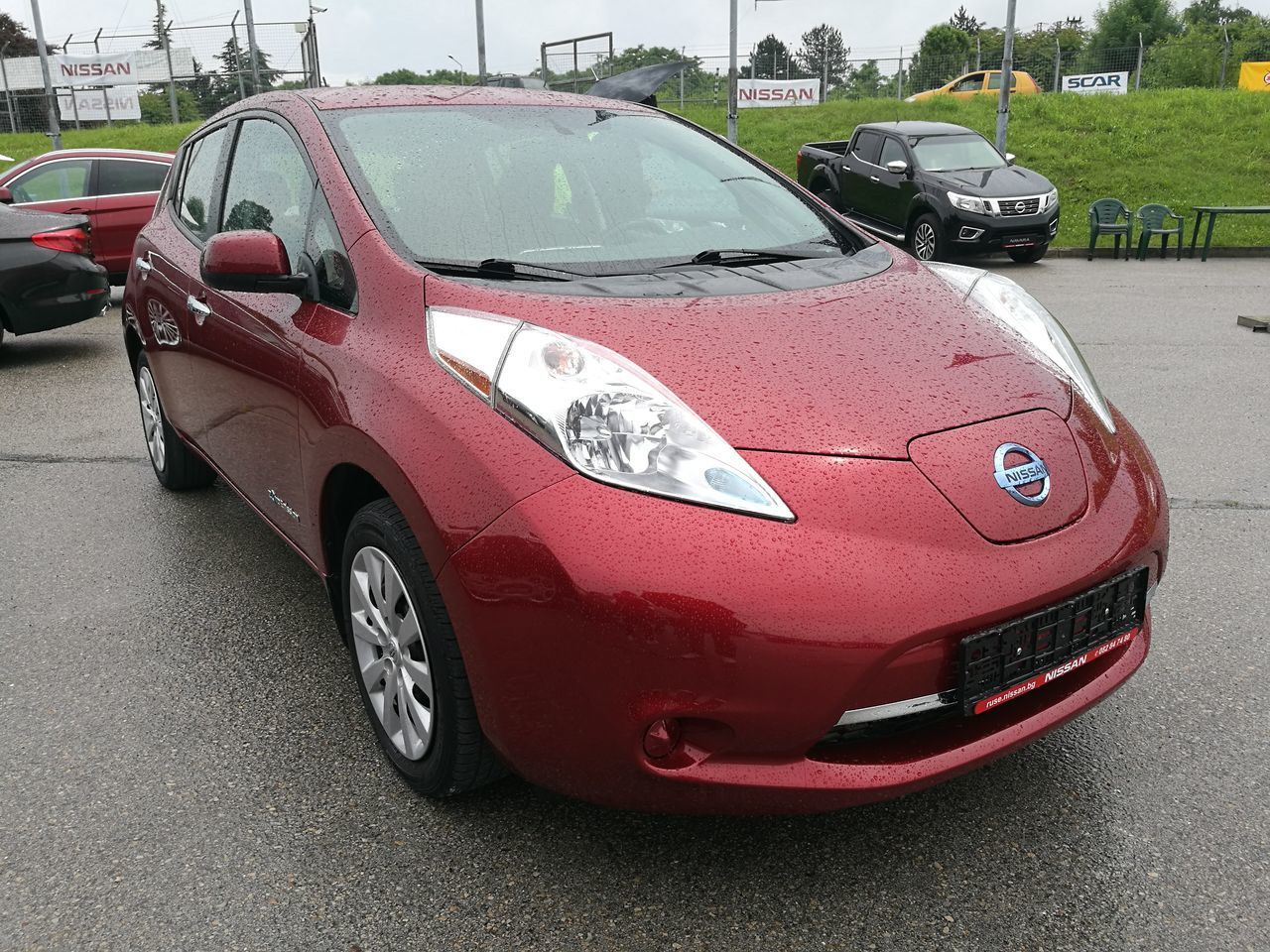 CLOSE-UP OF CAR PARKED ON STREET