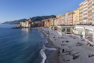 Panoramic view of sea and buildings against sky