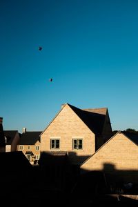 Low angle view of houses against sky