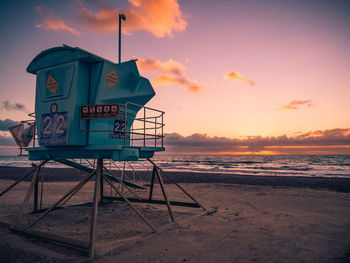 Lifeguard tower at carlsbad, california beach at sunset.