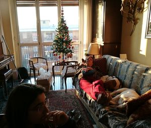 Young woman lying on sofa at home