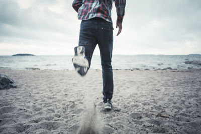 Low section of man on beach