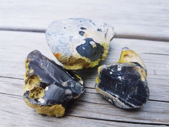 High angle view of stones on wood