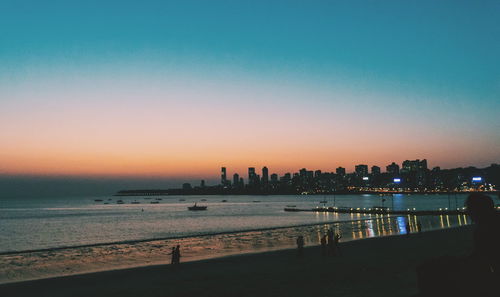 View of illuminated city at sunset