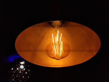 Low angle view of illuminated light bulb