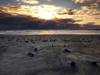 Scenic view of sea against sky at sunset