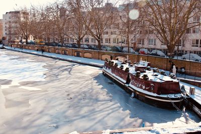 Scenic view of river in city during winter