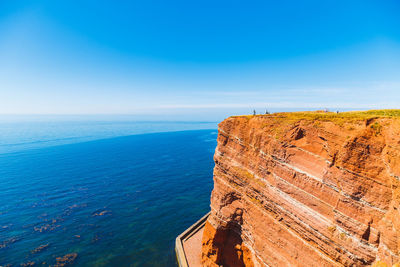 Scenic view of sea against blue sky