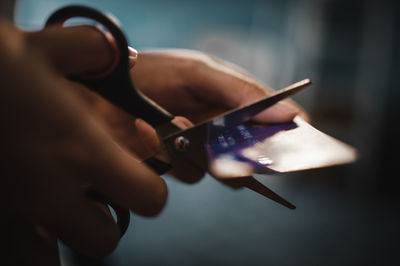 Close-up of hand holding mobile phone