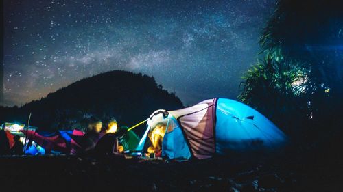 High angle view of tent on field against sky at night