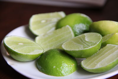 Close-up of fruits in plate on table