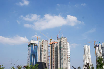 Low angle view of buildings against sky in city