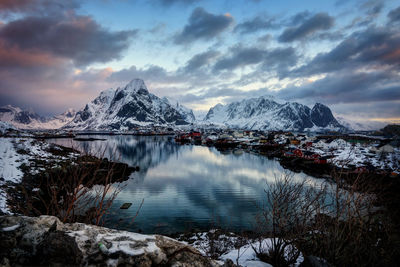 Scenic view of frozen lake against sky during winter