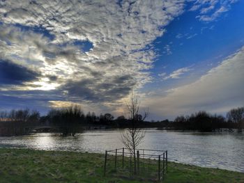 Scenic view of lake against sky during sunset