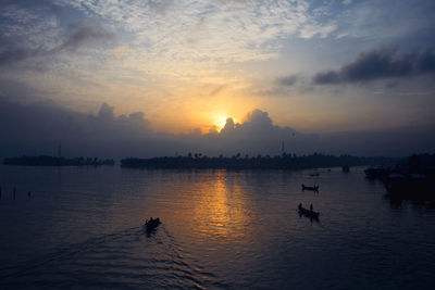 Scenic view of lake at sunset