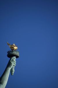 Statue of liberty against clear blue sky