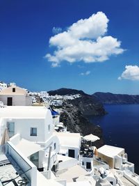Townscape by sea against blue sky, oia, santorini , greece 