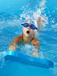 Man swimming in pool