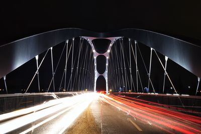 Illuminated suspension bridge at night