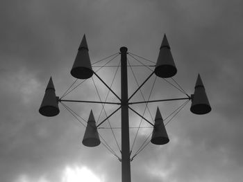 Low angle view of communications tower against sky